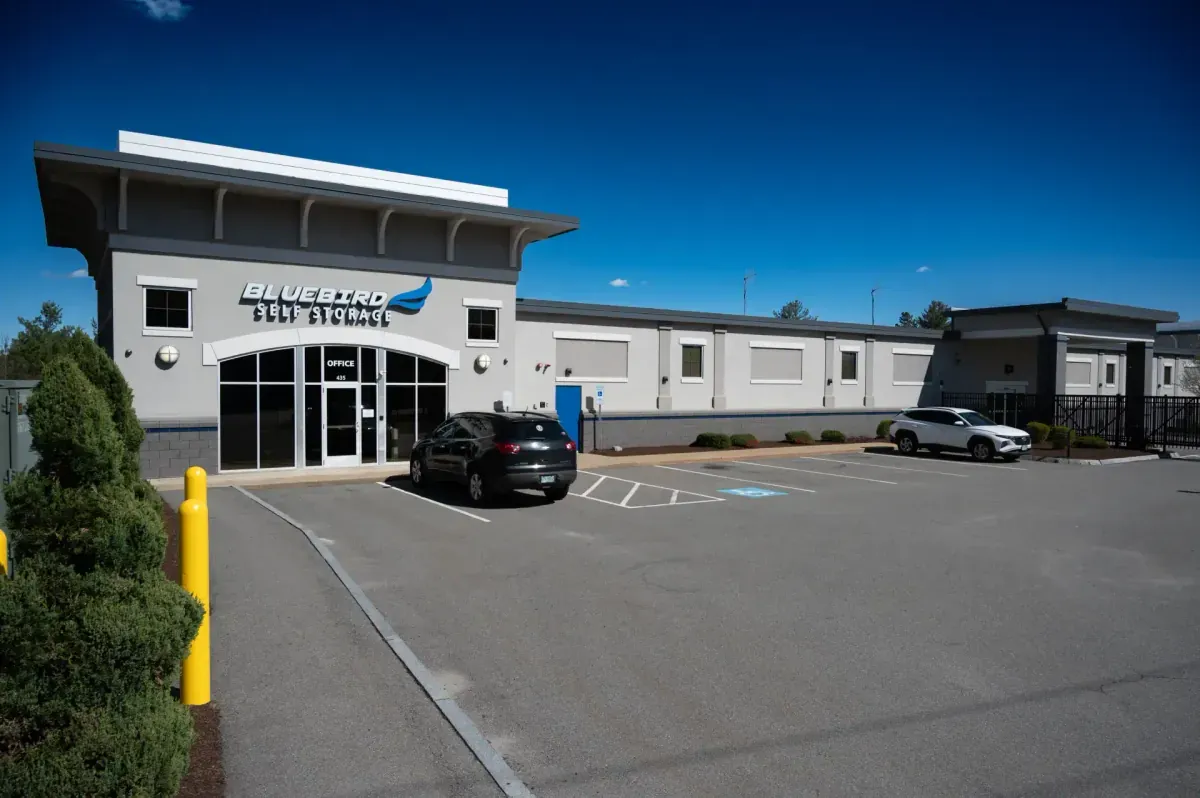 Bluebird Self Storage exterior with parking lot and office entrance