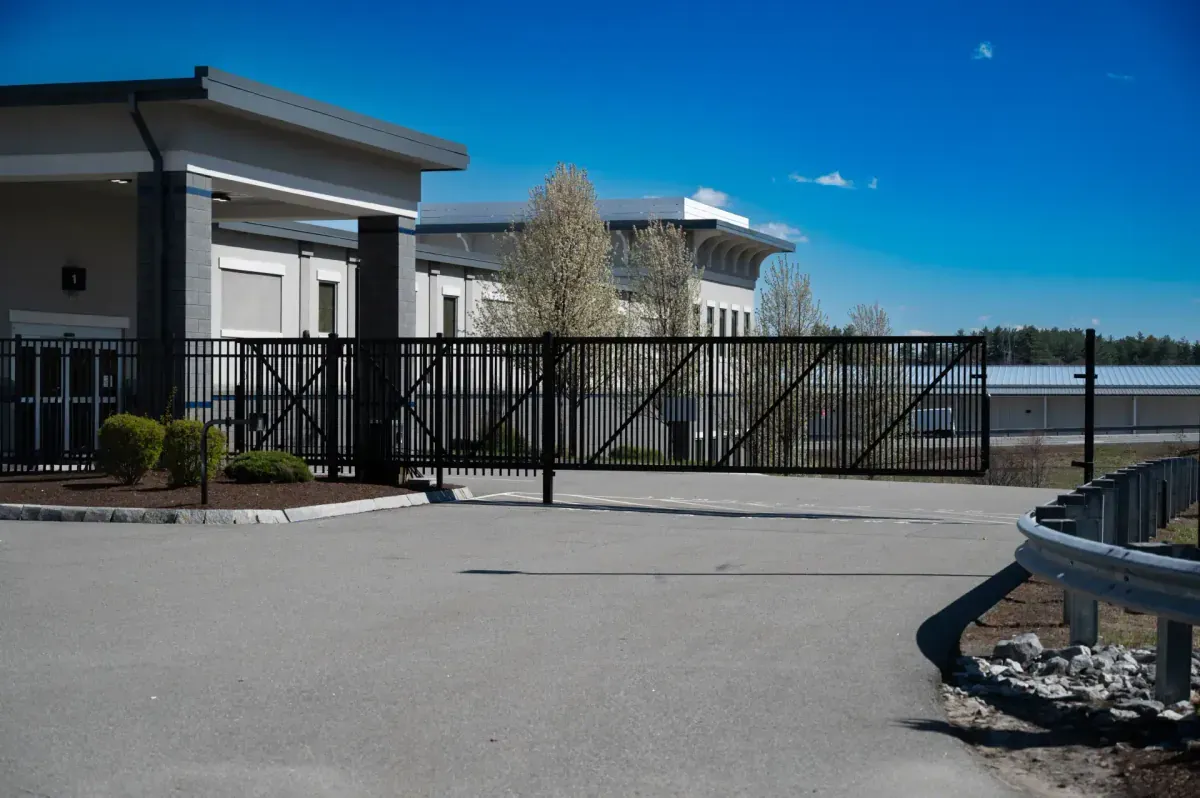 Black security gate entrance at Bluebird Self Storage