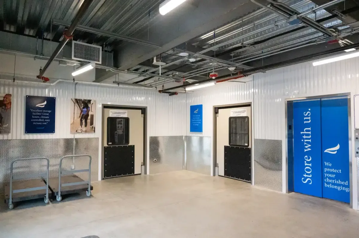 Indoor loading area with elevator and cart