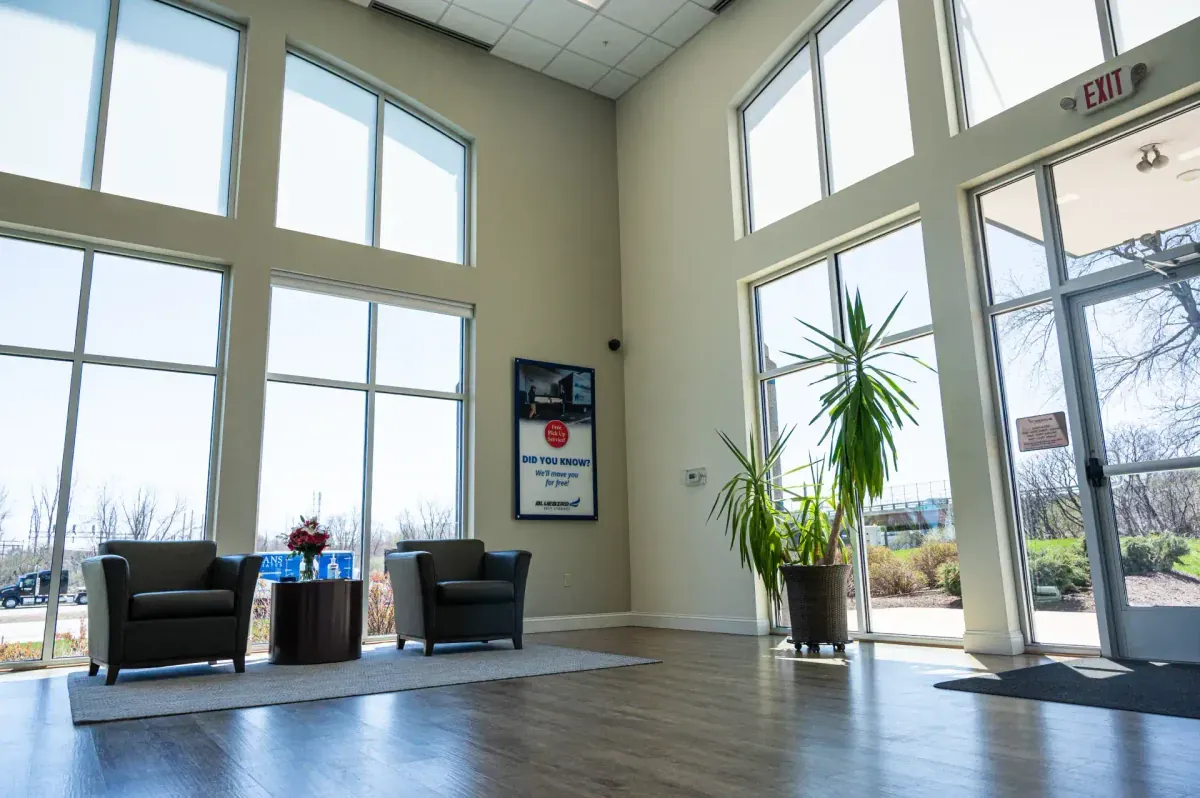 Bright Bluebird lobby with seating and large windows