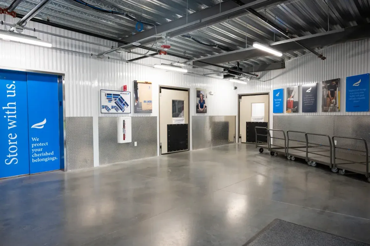 Indoor loading area with elevator and moving carts