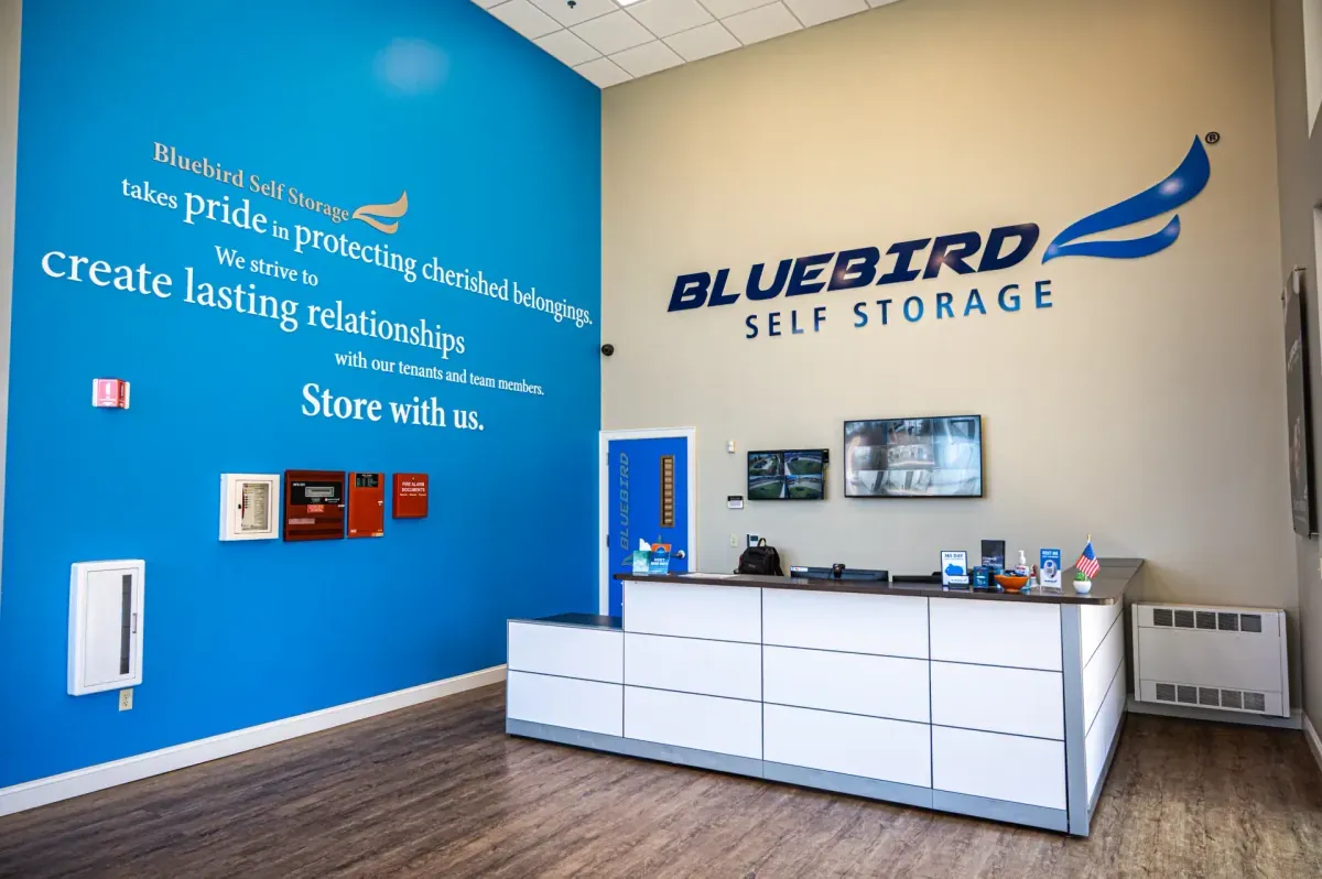 Bluebird office with brand wall and front desk
