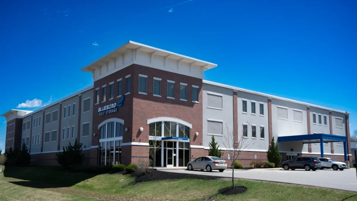 Bluebird Self Storage brick exterior with parking lot