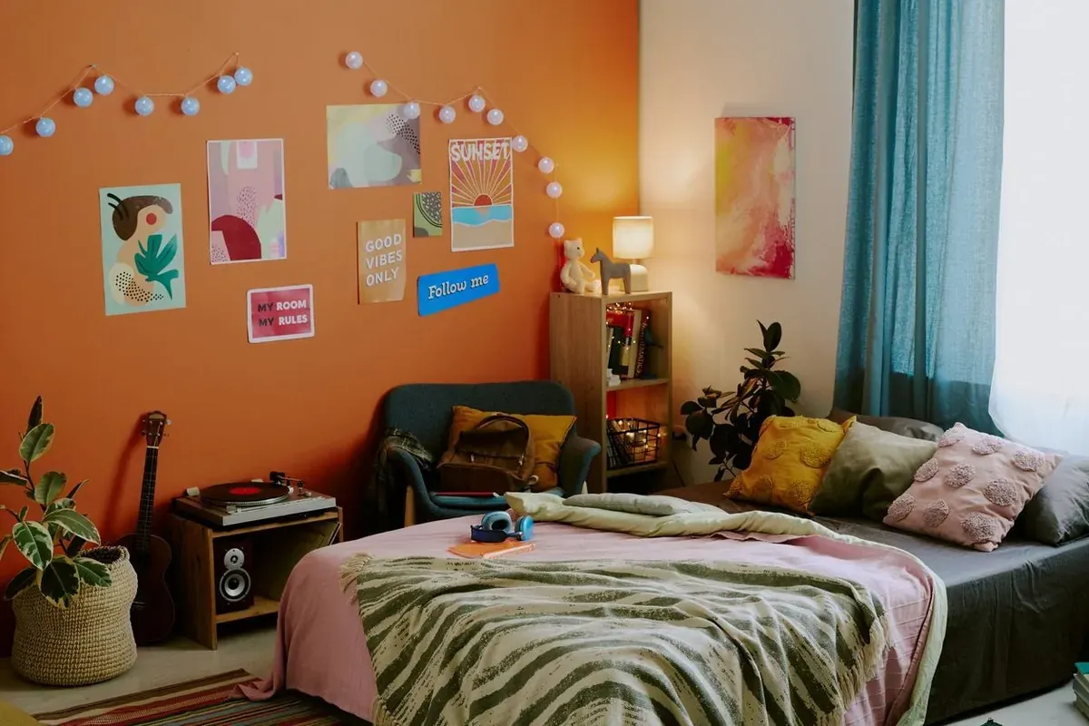 Image of a bedroom with a Zebra print blanket on the bed.